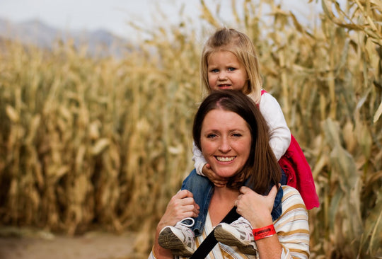 Maze_Mom Daughter_on shoulders smiling.jpg