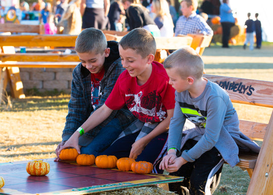 Courtyard_Boys_Playing Pumpkin Board Game.jpg