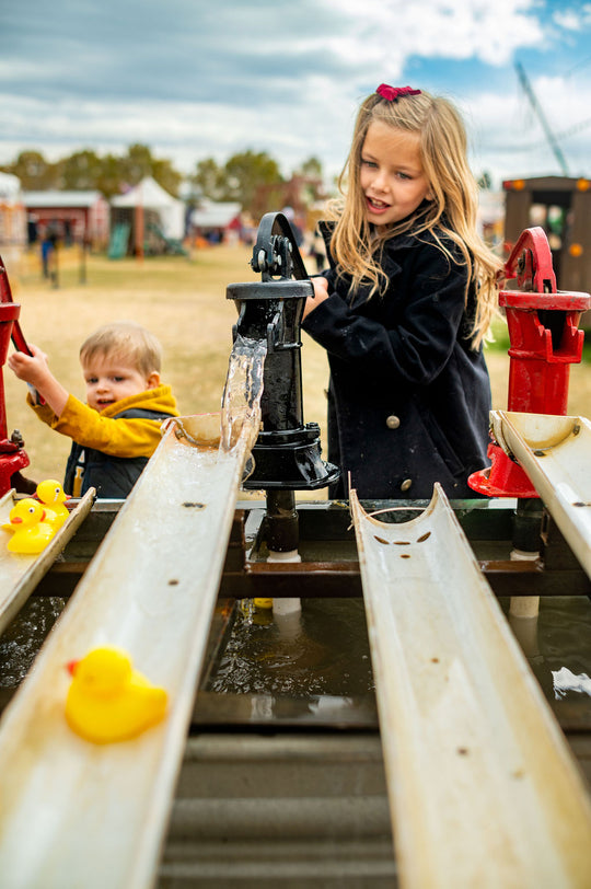 Duck Races_Girl_Pumping water_RJ.jpg