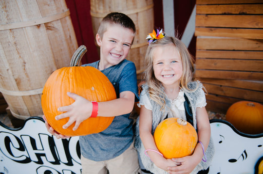 Pumpkin_Boy Girl_Carrying Smiling Wyatt Kate.jpg