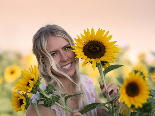 Sunflower_Woman_Peeking Behind.jpg